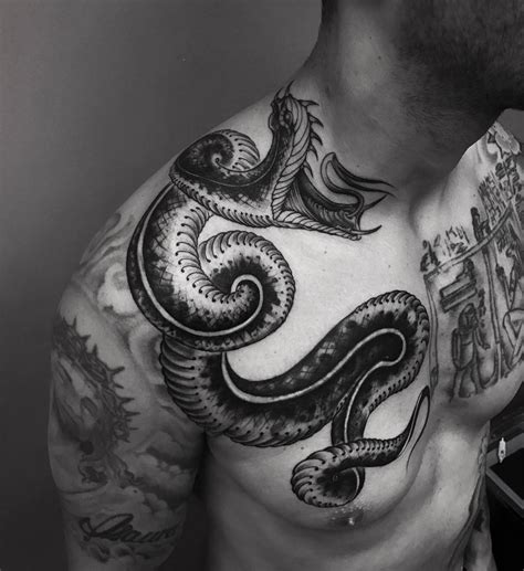 snake shoulder tattoos for men.